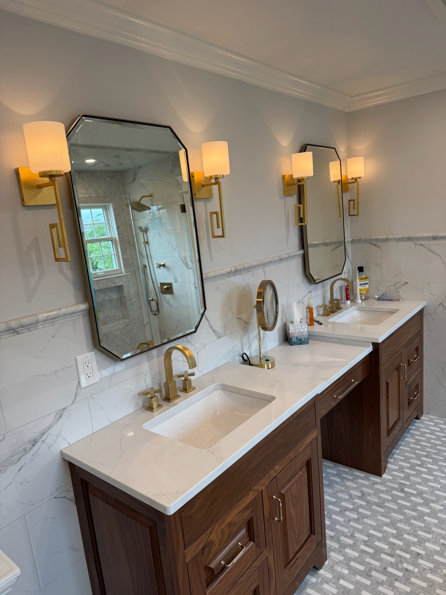 Mirrors above handwashing basin.