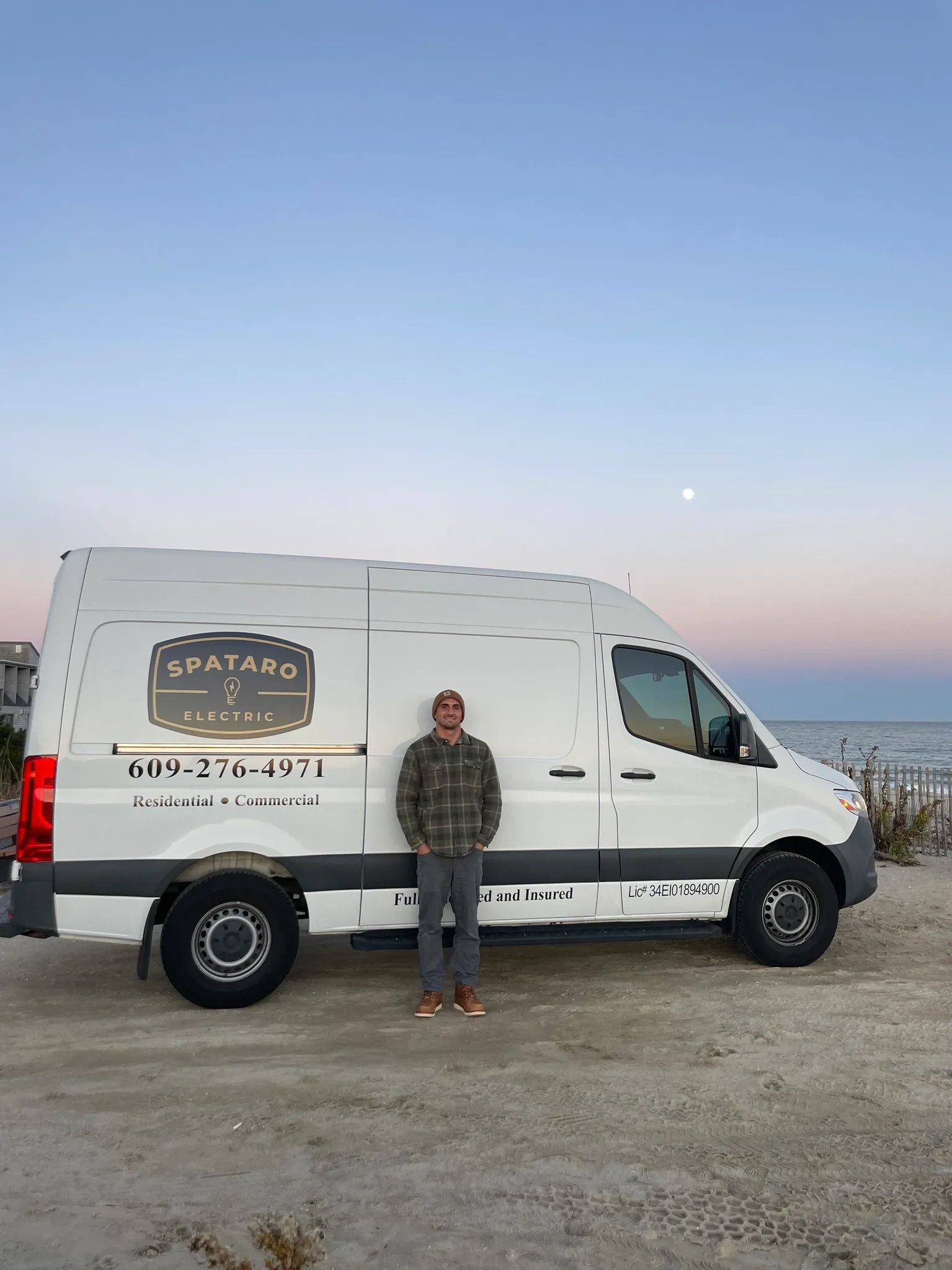 Man standing next to Spataro Electric van.