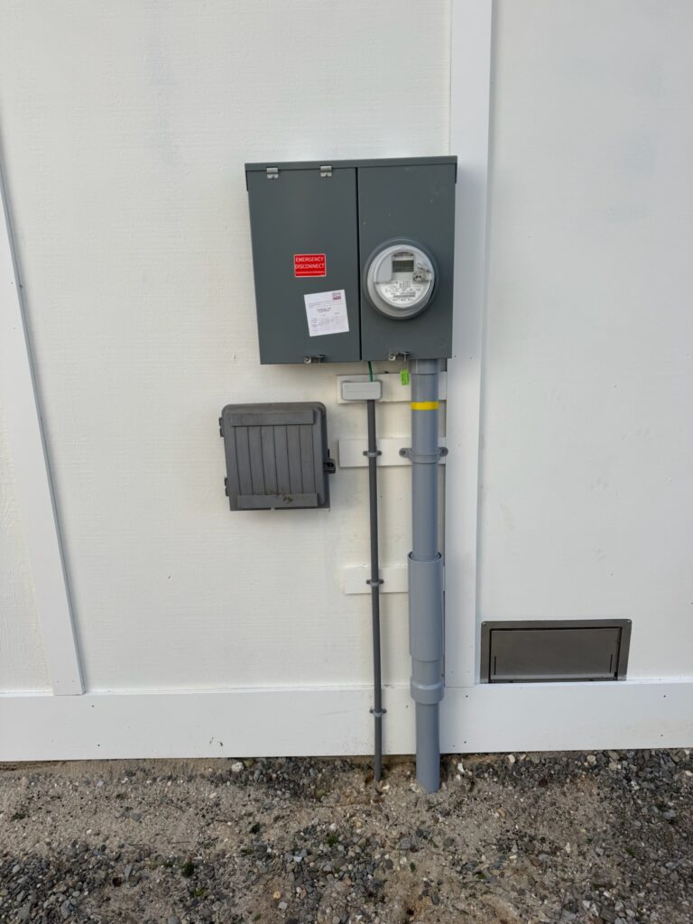 Underground 200 amp service on house wall.